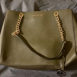 Authentic Michael Kors handbag. See closet for matching wallet.